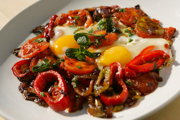 Eggs with paprika and vegetables, restaurant Croatia.