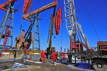 Naklejka premium Oil field oil workers at work