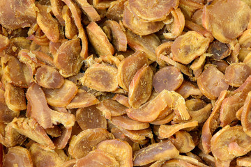 Snack to beer, chips of fish meat. Macro detail background