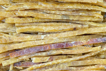 Snack to beer, sticks of fish meat. Macro detail background