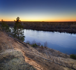 Evening landscape with a river, at sunset. Photographed in the central part of Russia.