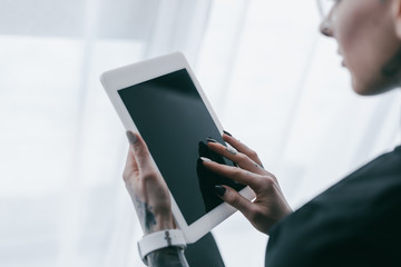 cropped shot of businesswoman using digital tablet with blank screen