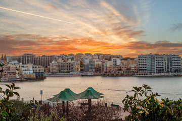 Sunset in St. Julians, popular Maltese resort and destination on Malta island. - obrazy, fototapety, plakaty