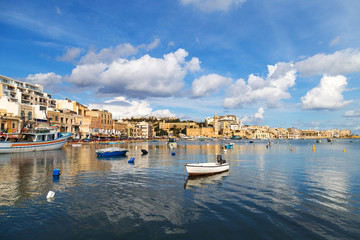 Fototapeta na wymiar Boats and yachts in a small marine on Malta, near Marsaskala.