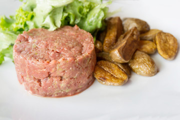 tasty Steak tartare (Raw beef) - classic steak tartare on white plate