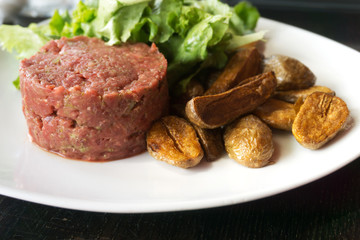tasty Steak tartare (Raw beef) - classic steak tartare on white plate