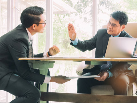 Businessman Passing Cash Money Under The Table To His Corrupted Partner, Corruption Concept