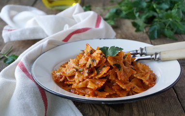 Pasta in tomato sauce with garlic and parsley