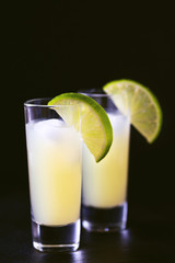 Italian lemon lime liqueur limoncello with ice and mint