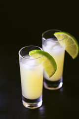Italian lemon lime liqueur limoncello with ice and mint