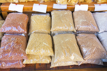 Traditional Greek food from grain packaged in the shelf of the shop (barley, trahanas)