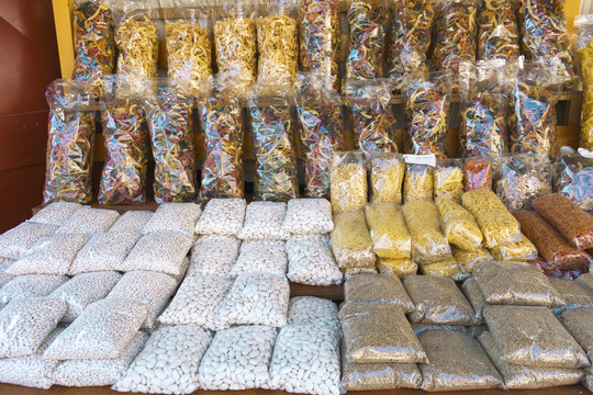Traditional Greek foods packed in the shelf of the store (beans, lentils, trachanas, barley, chilopites, fides )