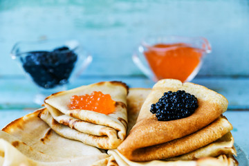 Russian Maslenitsa, pancakes with red and black caviar