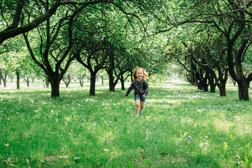 Cute little girl running in the park