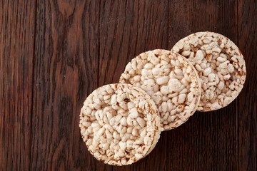 Stack of crispbreads on dark wooden table