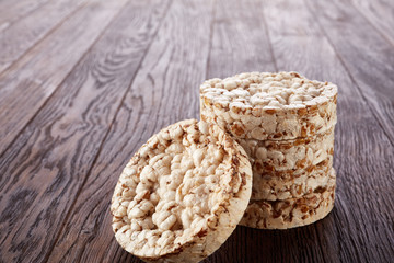 Stack of crispbreads on dark wooden table