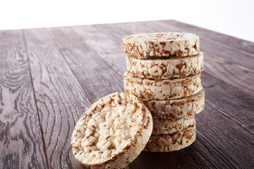 Stack of crispbreads on dark wooden table