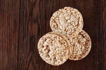 Stack of crispbreads on dark wooden table