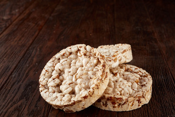Stack of crispbreads on dark wooden table