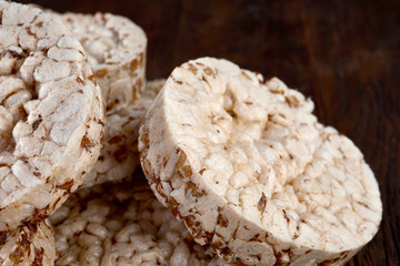 Stack of crispbreads on dark wooden table