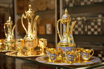 Fototapeta na wymiar Traditional Arabic coffee sets with traditional coffee pot in the Arab market in Jerusalem
