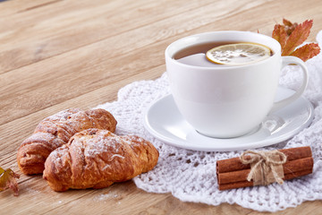 white cup of tea with cookies on a wooden background white cup of tea with cookies on a wooden background. copy space.