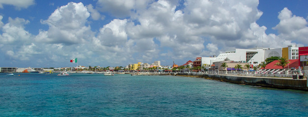 Panorama of Cozumel coastline and city skyline with bay and clouds