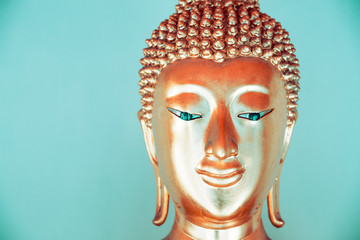 buddha face with empty wall for editing text behind