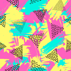 Colorful seamless pattern from triangles on the bright brush strokes background. 80's - 90's years design style.