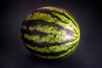 Watermelon on black background.