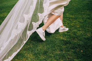 bride run dress sneakers grass spring