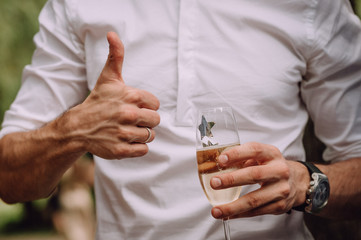 man gestures super hands glass shirt