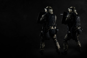 The man in the image of a member of the SWAT police with weapons
