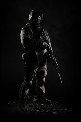 The man in the image of a member of the SWAT police with weapons