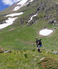 Fototapeta na wymiar Traveler with a backpack in the mountains.