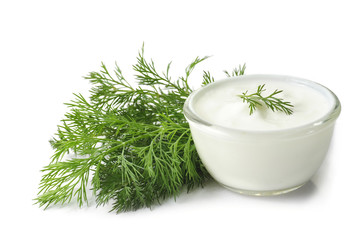 fresh dill and sour cream on a white background