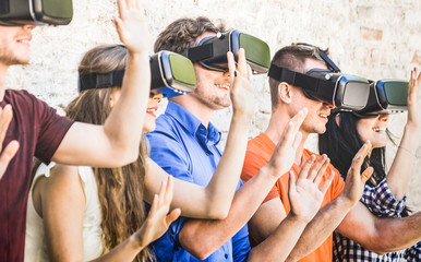 Group of friends playing on vr goggles outdoors - Virtual augmented reality and wearable tech...