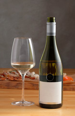 Mockup wine bottle with a glass of white wine 