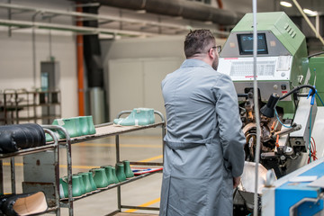 Fototapeta na wymiar manager at a leather shoe manufacturing factory