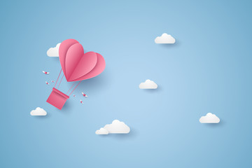 Valentines day, Illustration of love, pink heart hot air balloon flying in the blue sky, paper art style