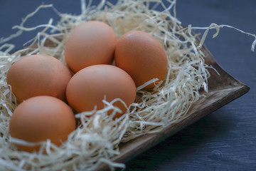 Chicken eggs on black background. Easter theme
