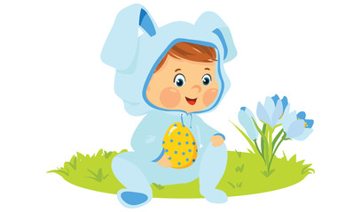 Baby boy in bunny costume with decorative egg