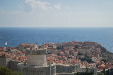 Obraz premium View onto Old Town of Dubrovnik with Sailing Boat from Lookout Point, Croatia