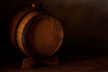 a small wooden wine bar, barrel on the legs and a wooden crane on a wooden background