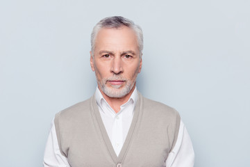 Job people age concept. Close up portrait of pensive thoughtful serious minded qualified with white bristle wrinkles old man wearing beige knitted waistcoat isolated on gray background copy-space