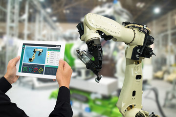 iot industry 4.0 concept,industrial engineer using software (augmented, virtual reality) in tablet...