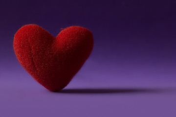 Red Heart stand alone on purple background. Valentine concept.