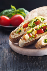 Puccia salentina- traditional Italian flatbread with tomatoes and mozzarella, Puglia.