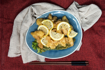 Chinese food fried fish and lemon slices