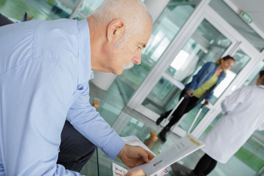 patients in doctors waiting room